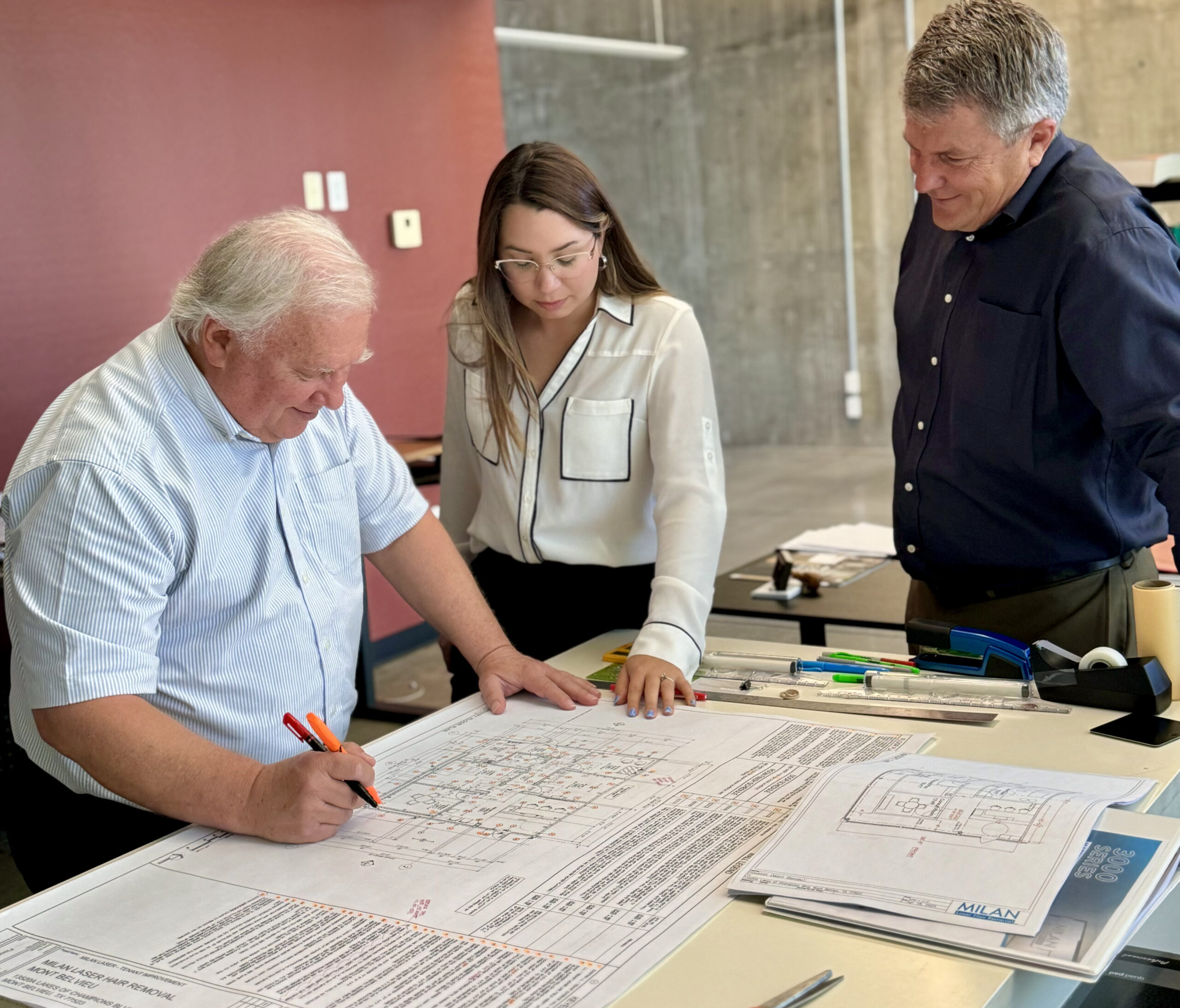 men holding blueprints